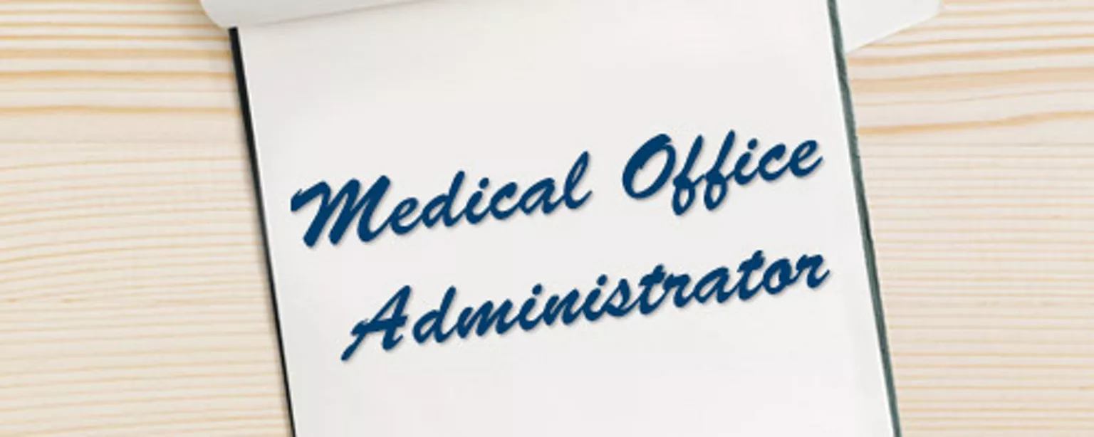 All You Need To Know For A Medical Office Administrator Career — notepad with pen and the words: Medical Office Administrator
