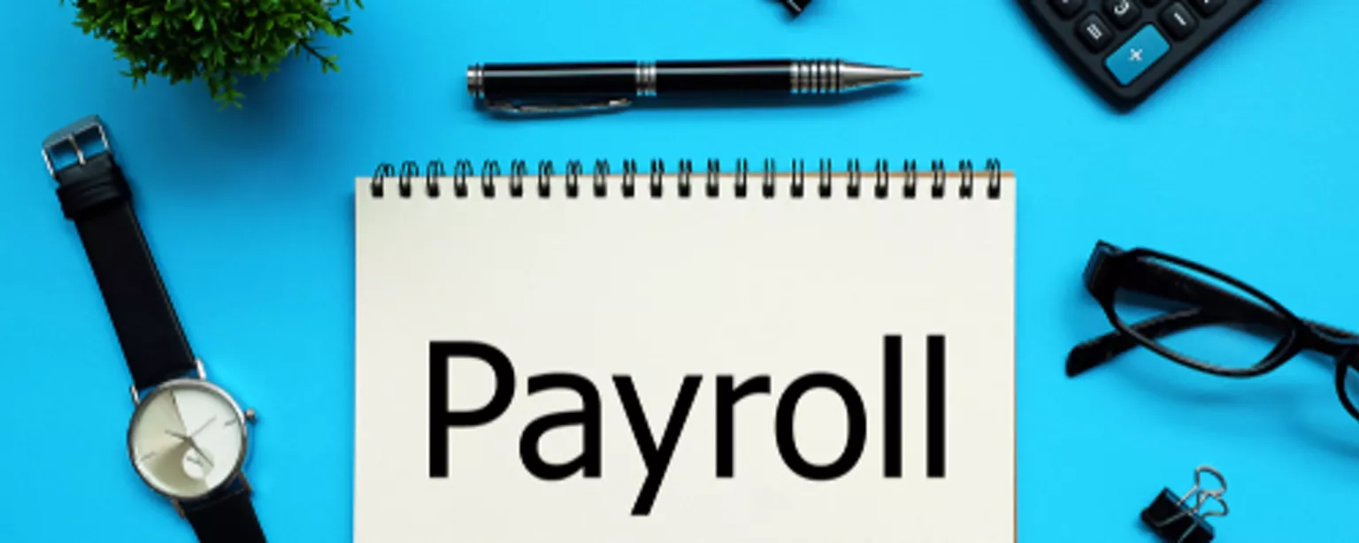 Kick-off a Career in Payroll - notebook with payroll written on it