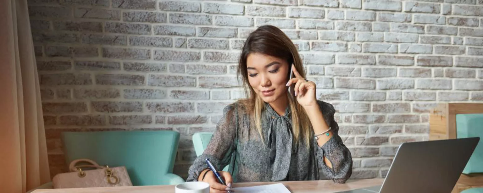 Get the Most Out of Your Phone Screen Interview Questions. Image of an employer talking on phone.