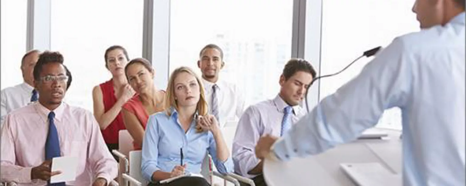 Man using presentation skills in front of group