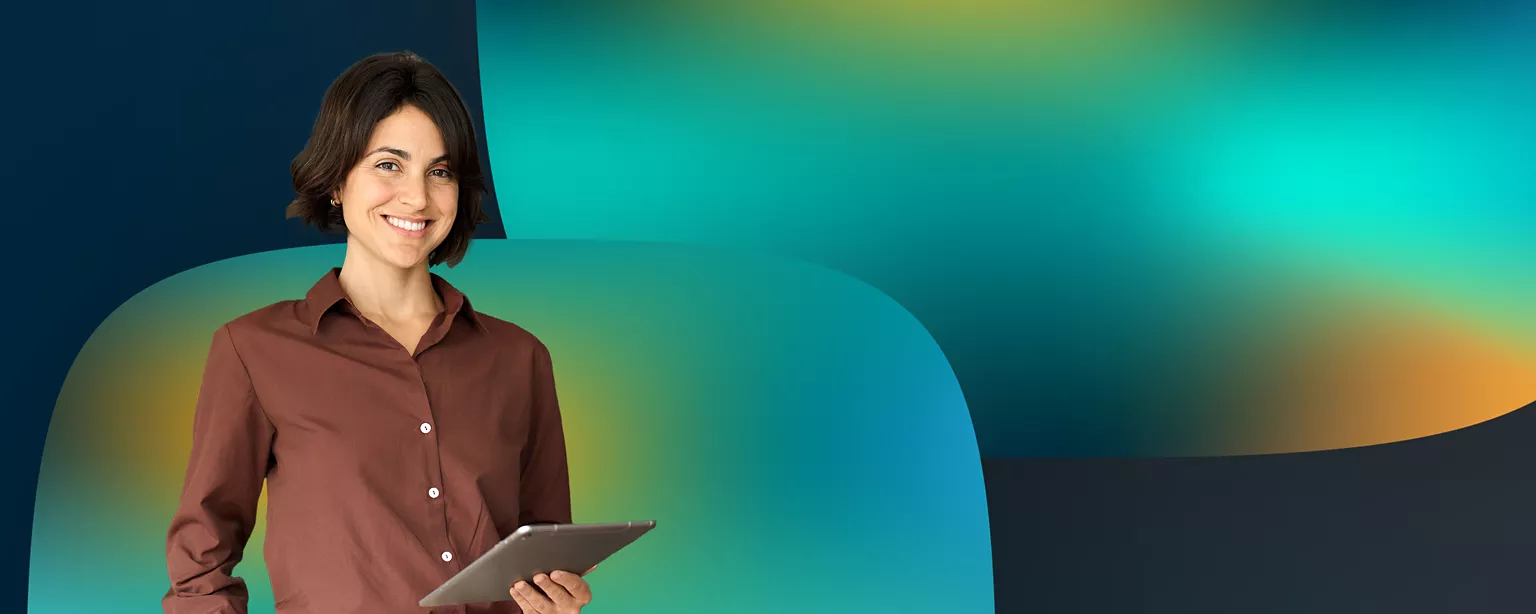 A woman in a brown shirt is holding a tablet and smiling while looking straight ahead.