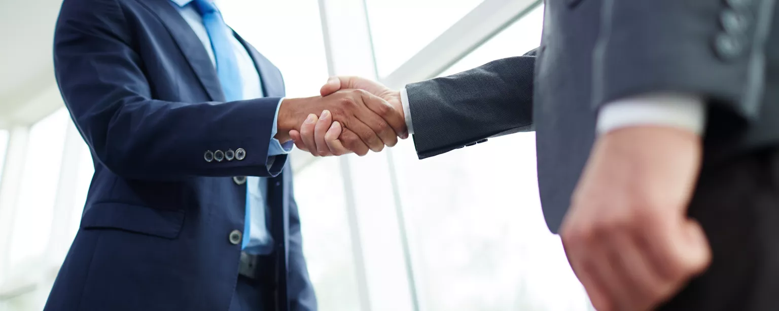 Recruiter shaking hands with a new client
