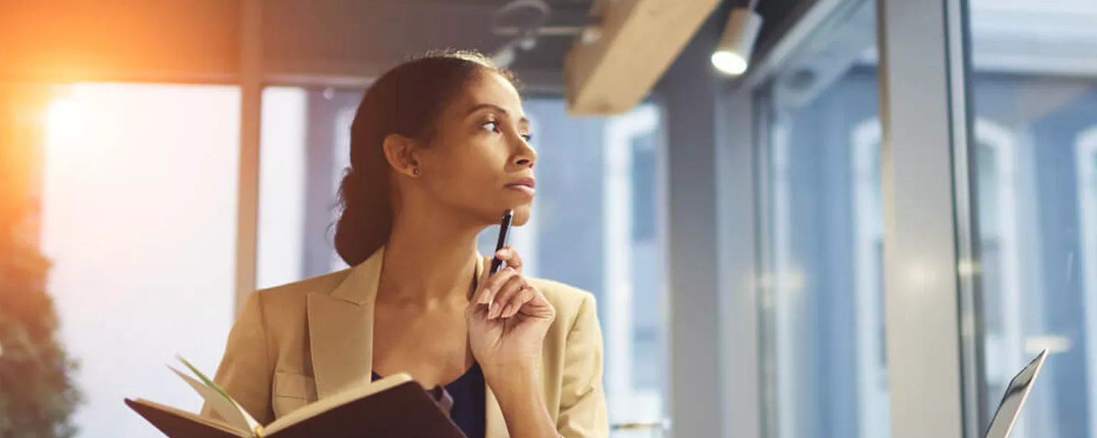 Business woman contemplates hiring a new temporary employee