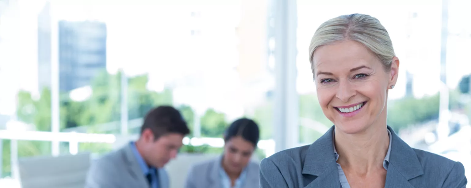 A recruiter smiling in her office.