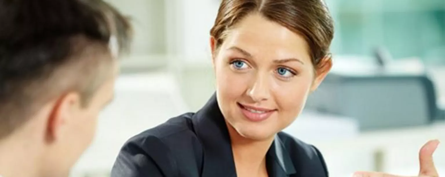 Woman speaking to man, displaying active listening skills