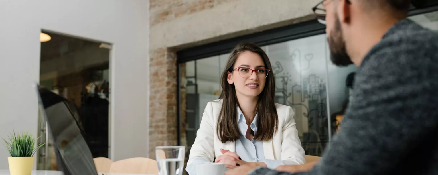 Image of a manager conducting a stay interview with an employee.