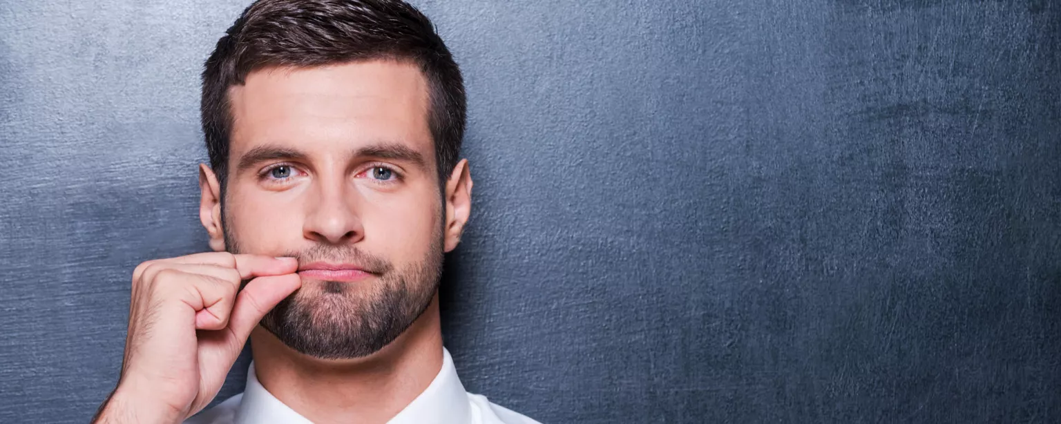 Vote Against Talking Politics in the Workplace — Man pretending to zip up his lip