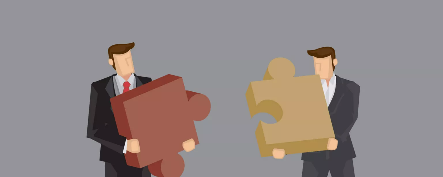 A illustration of two businessmen holding puzzle pieces that fit together