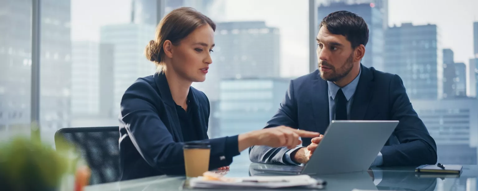 An internal audit professional shares her audit findings with a business leader.