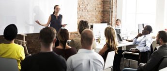 People watching a woman speak