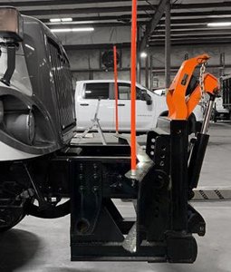 Spreader attached to front of truck