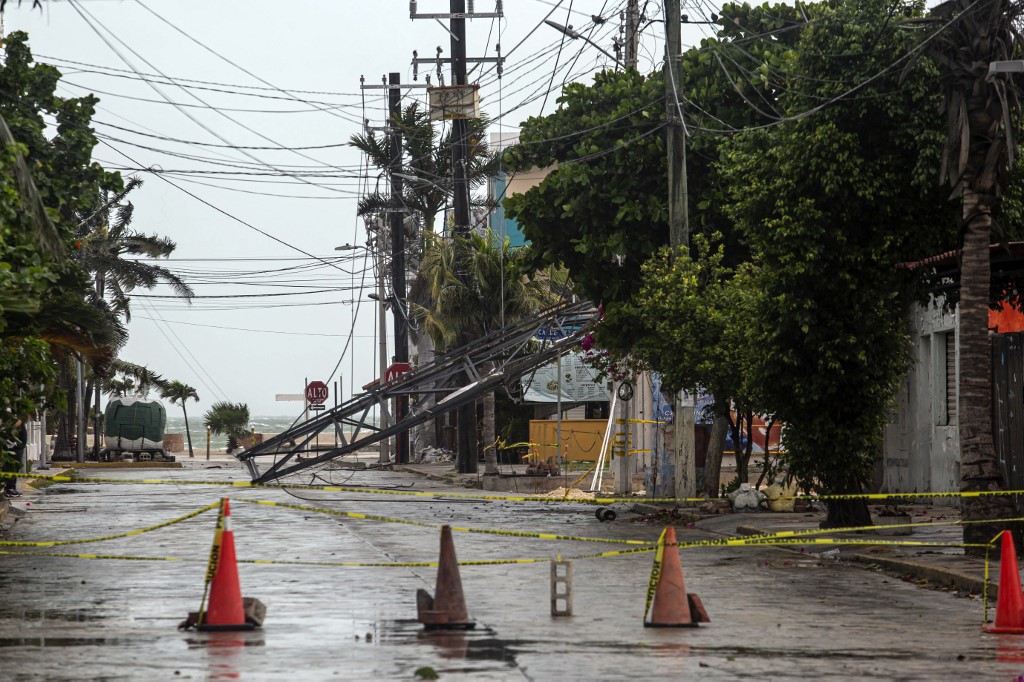Some damage caused by strong winds during the passage of tropical storm Beryl is seen in Progreso, Yucatan Peninsula, Mexico, on July 5, 2024. Beryl weakened to a tropical storm Friday after hitting Mexico as a Category 2 hurricane, with fierce winds causing material damage but no injuries along the tourist-rich Yucatan Peninsula. (Photo by HUGO BORGES / AFP)