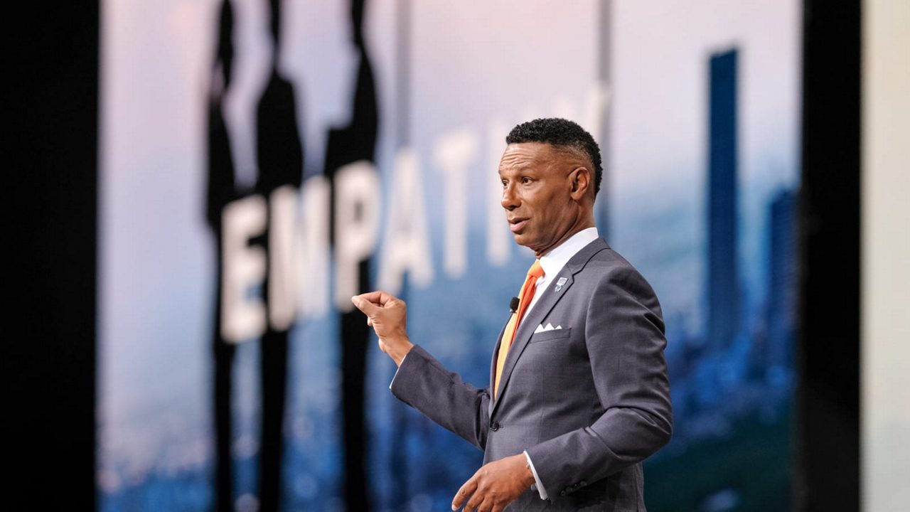 Johnny C. Taylor Jr. giving a speech at a conference.