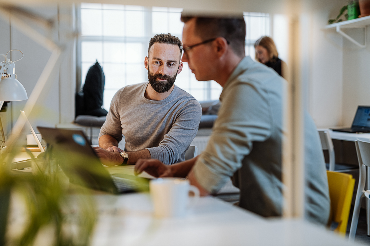 Diverse entrepreneurs and small business owners working in coworking space.Programmers and software engineers working in office