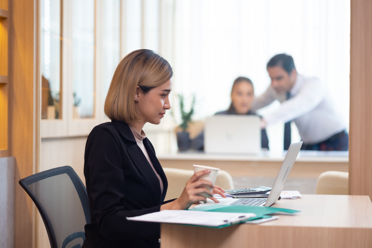 Asian woman. Happy excited successful Beautiful businesswoman triumphing in modern office with laptop Work from home and social distancing concept