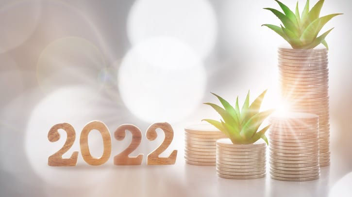 A stack of coins with the word 2020 on top of them.