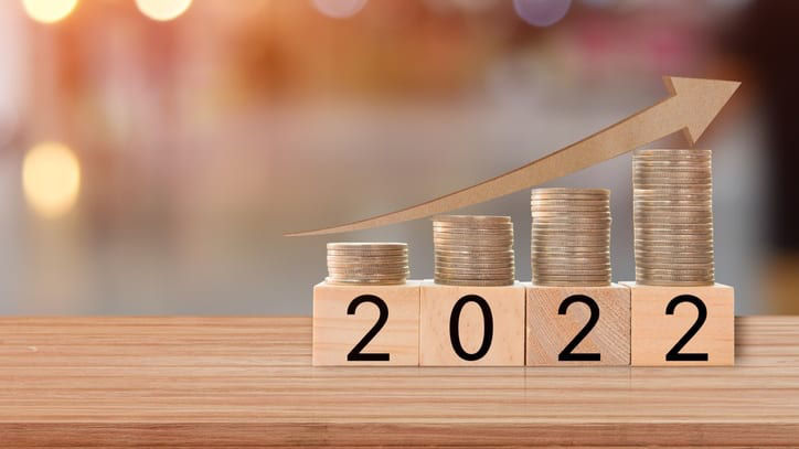 A stack of coins with the word 2020 on top of it.