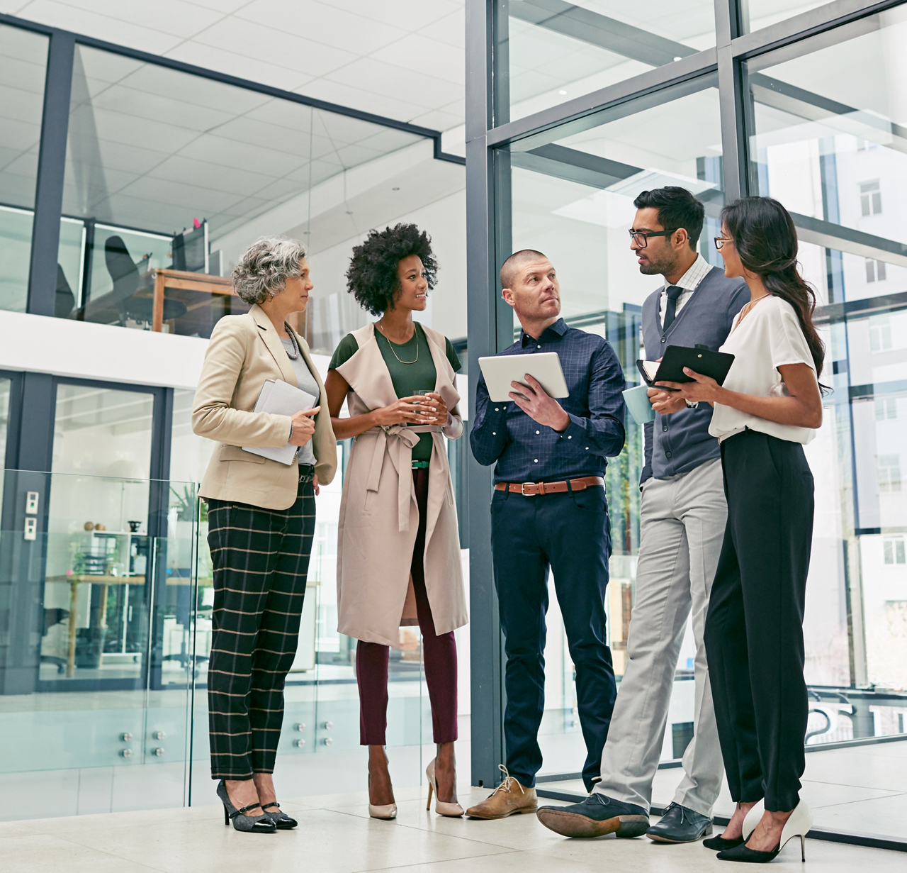 Shot of a group of colleagues having an informal meeting in an office