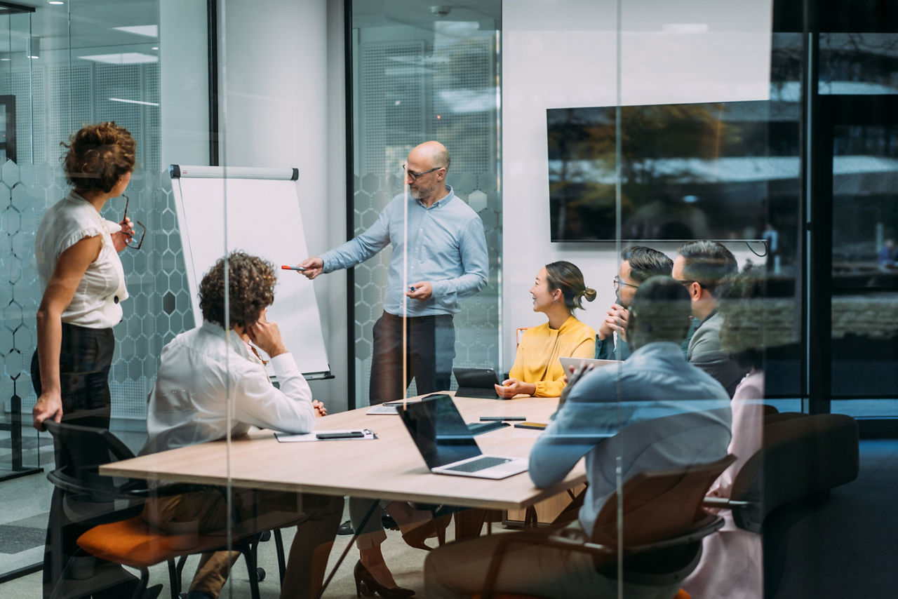 Office meeting in conference room.