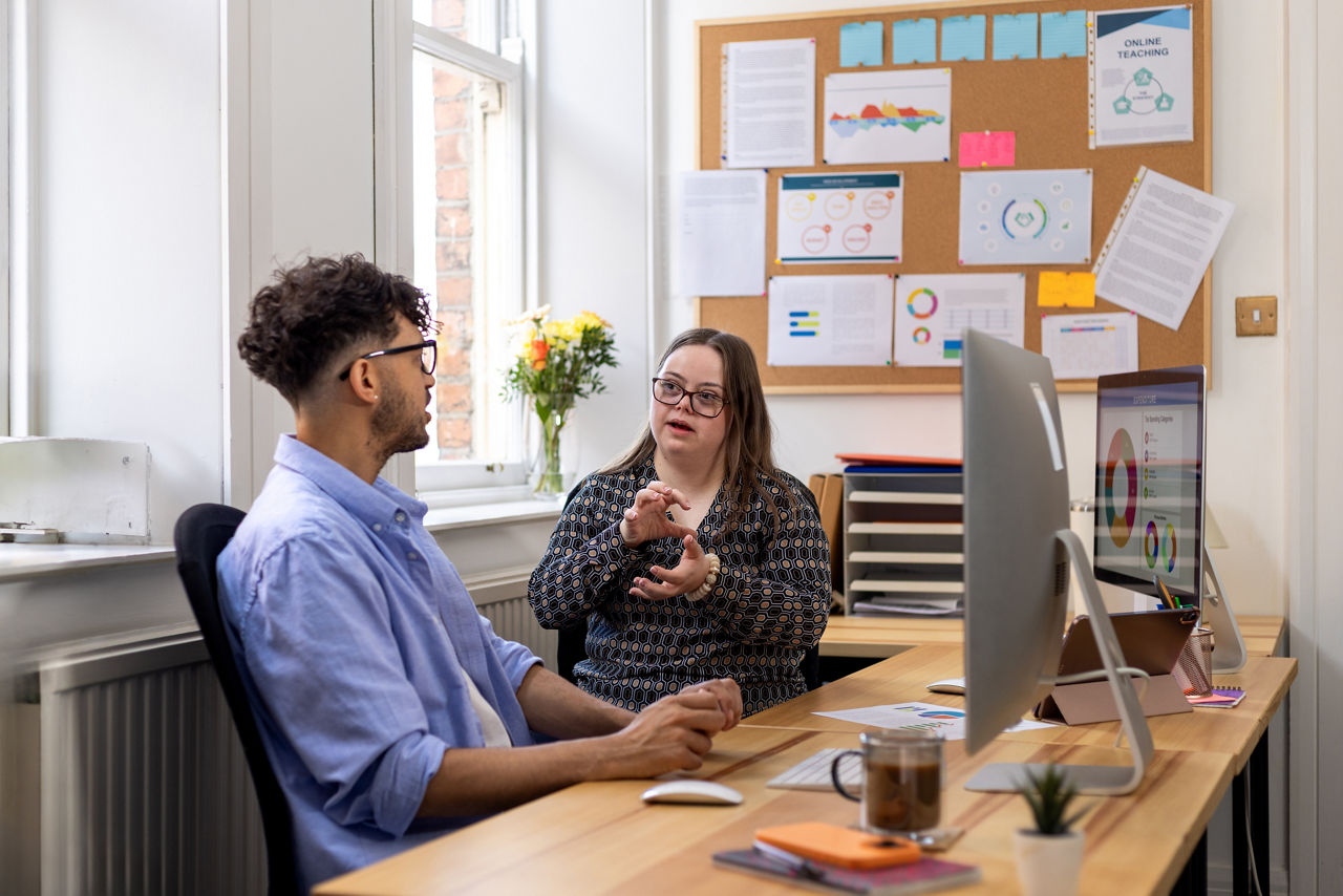 Colleagues talking to one another