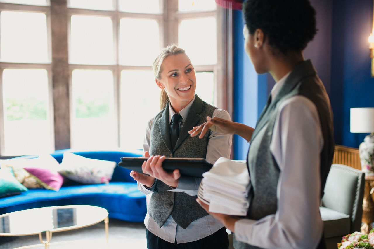 Two women conversing at work