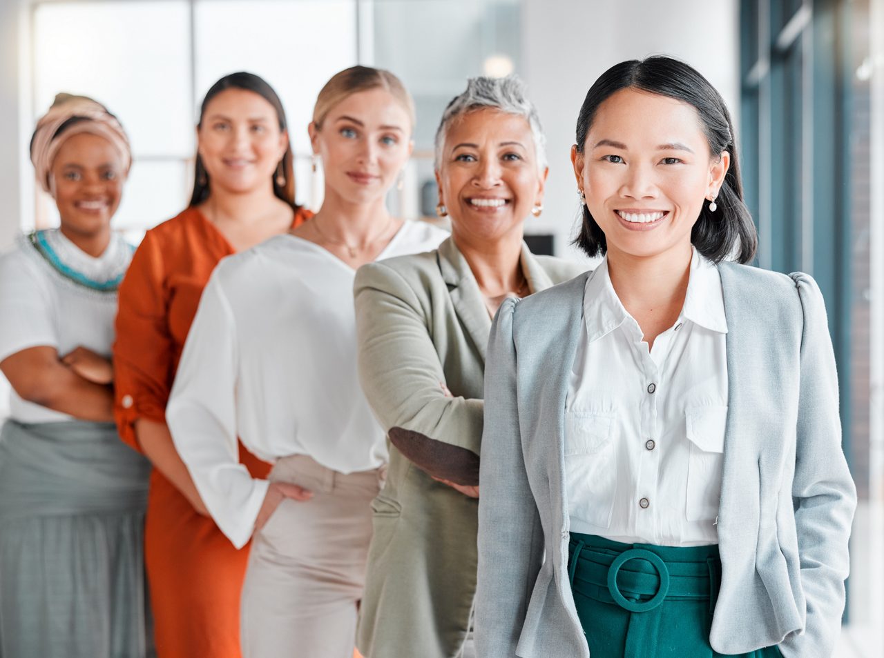 Professional women standing and smiling