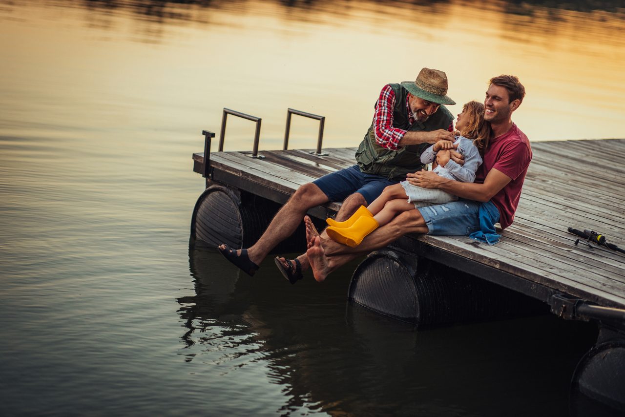 Family sitting on dock