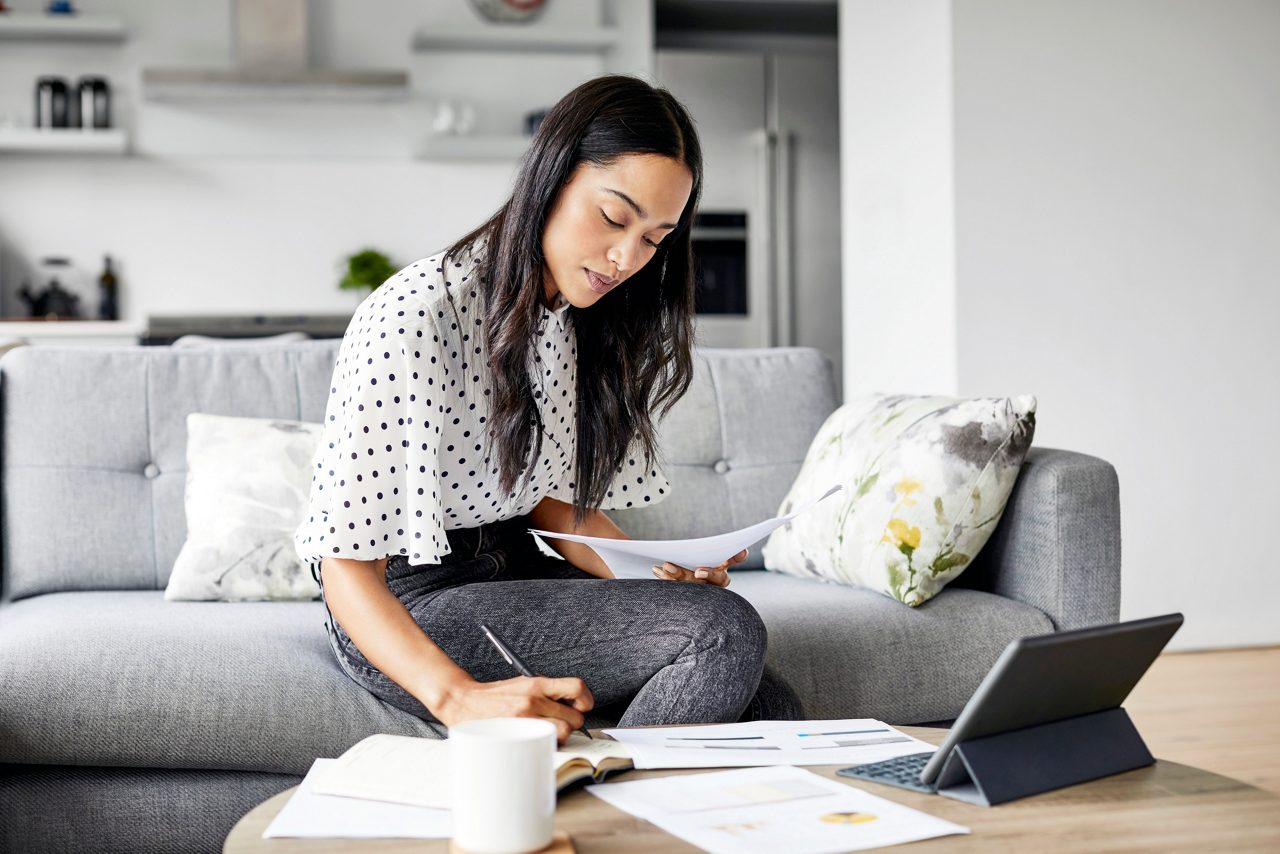 Woman on computer on couch