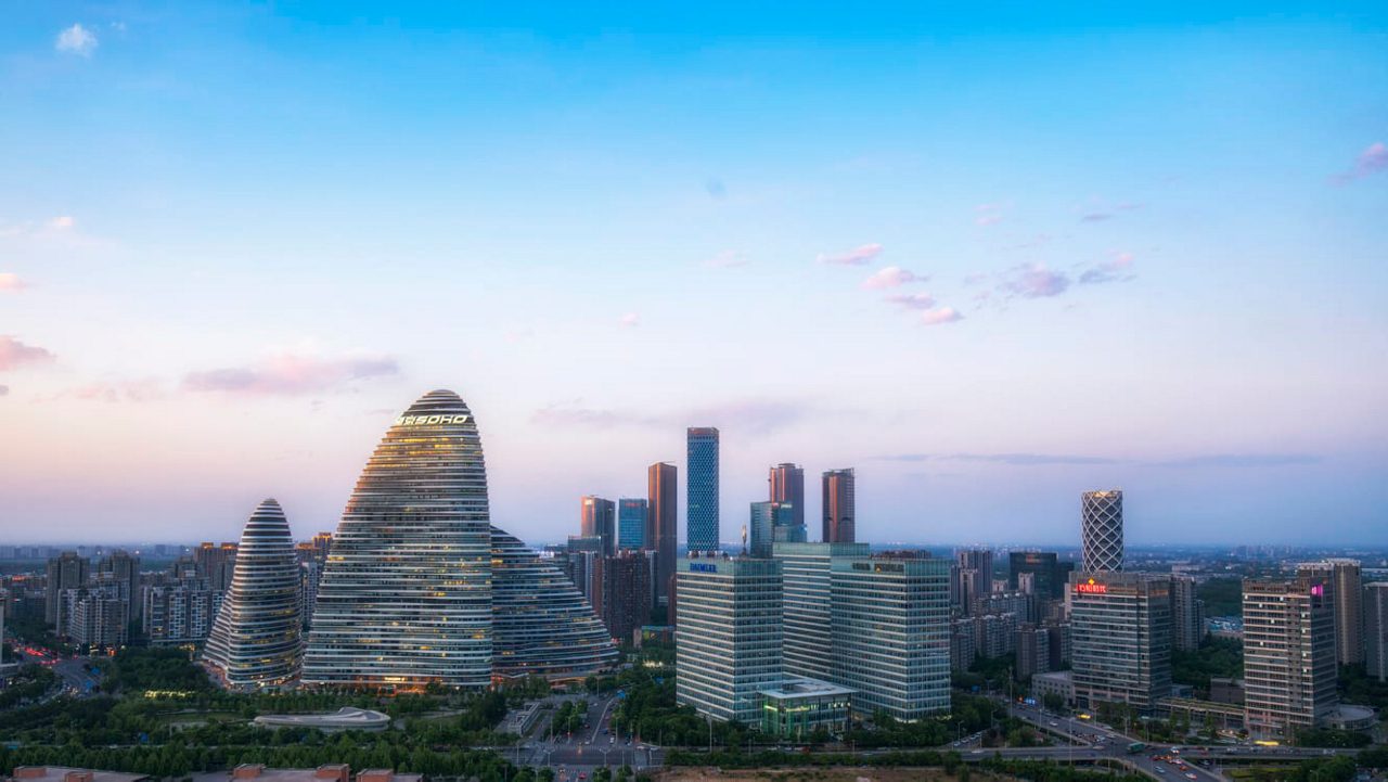 An aerial view of a city with tall buildings.