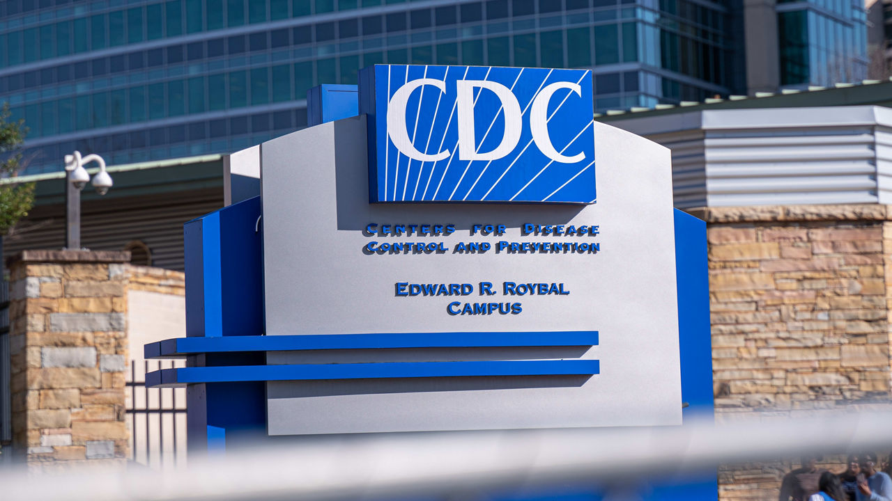 The cdc sign is in front of a building.