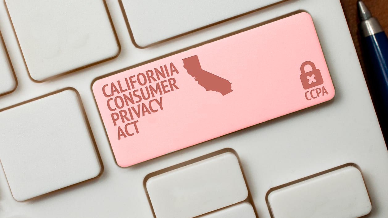 A california consumer policy sticker on a keyboard.