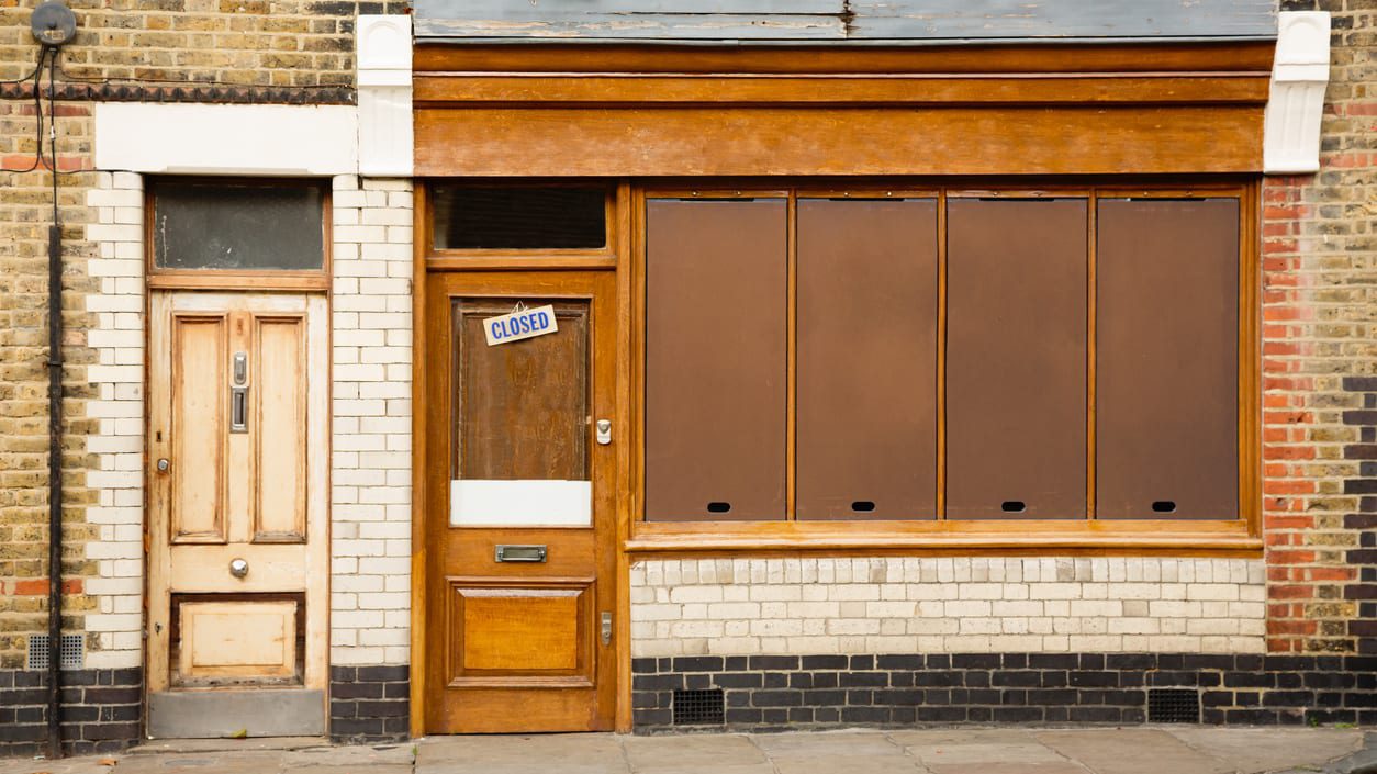 A brick building with a wooden door.