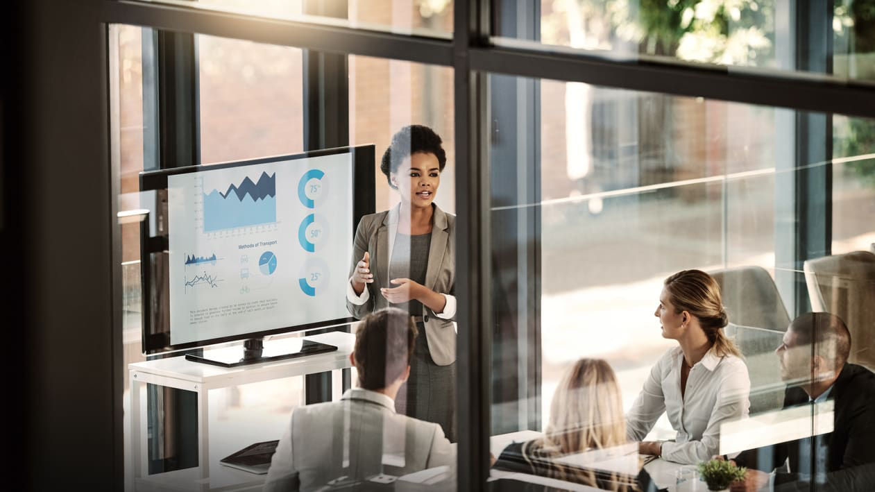 A group of business people in a meeting room.
