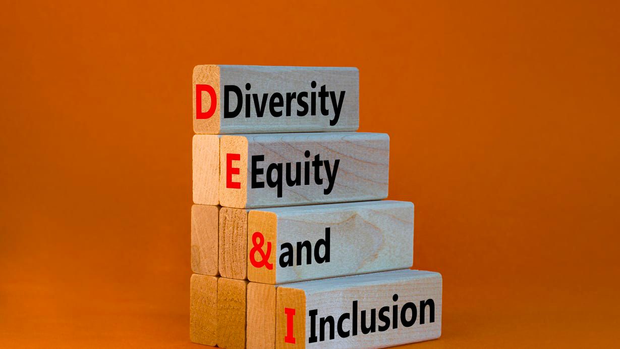 A stack of wooden blocks with the words diversity, equity and inclusion.