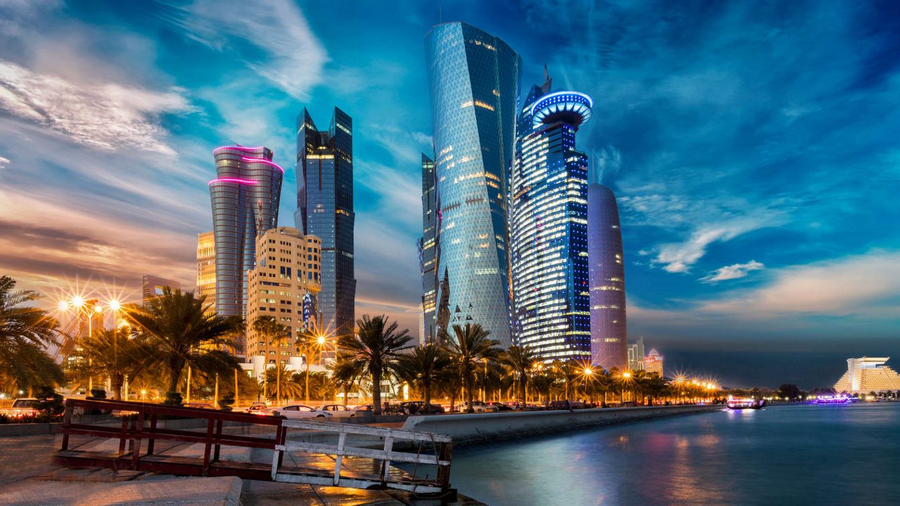 The skyline of doha, qatar at dusk.