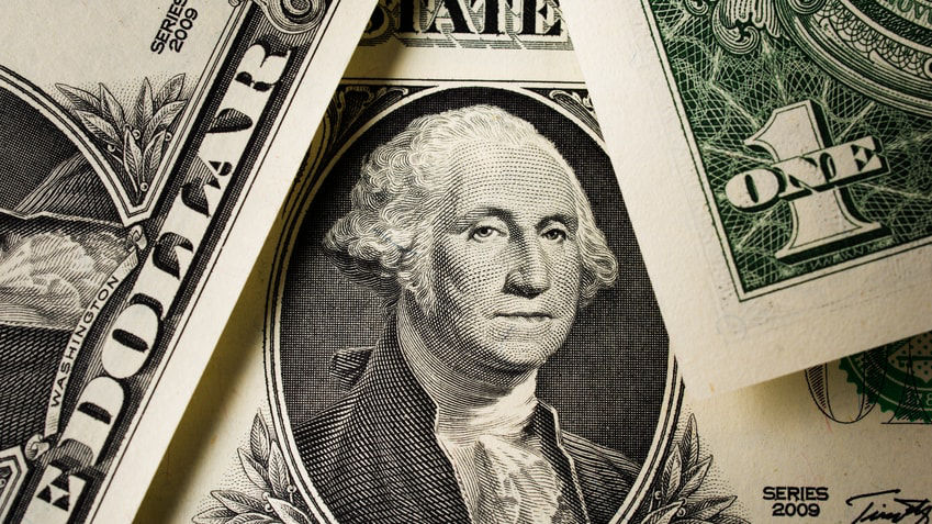 A stack of us dollar bills with a portrait of george washington.