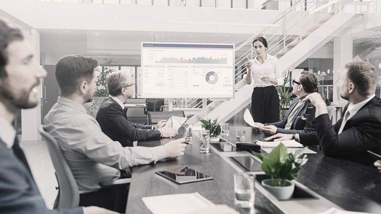 A group of business people in a conference room.