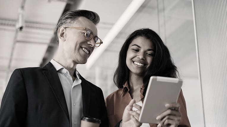 Two business people looking at a tablet computer.