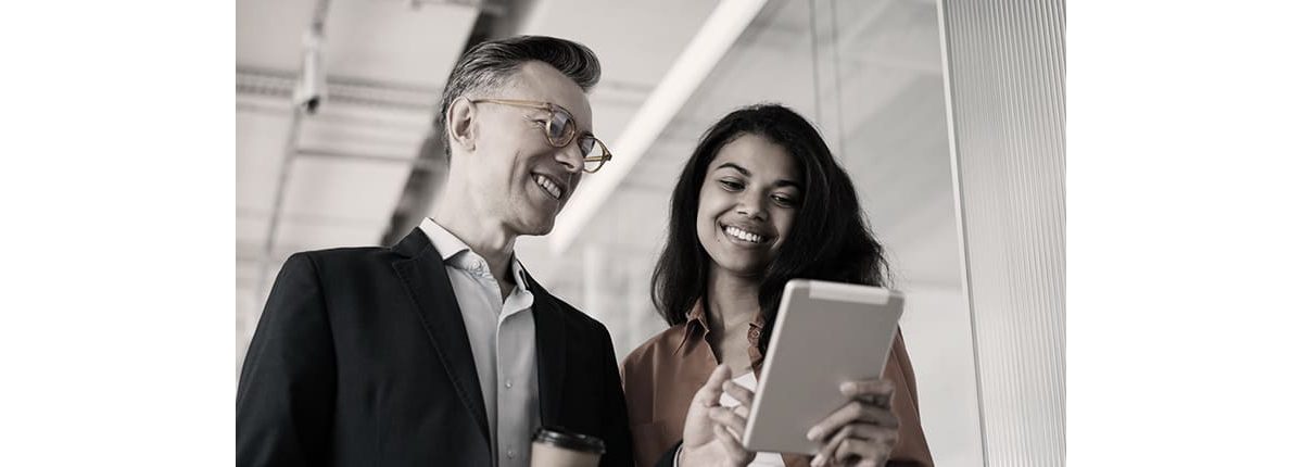 Two business people looking at a tablet computer.