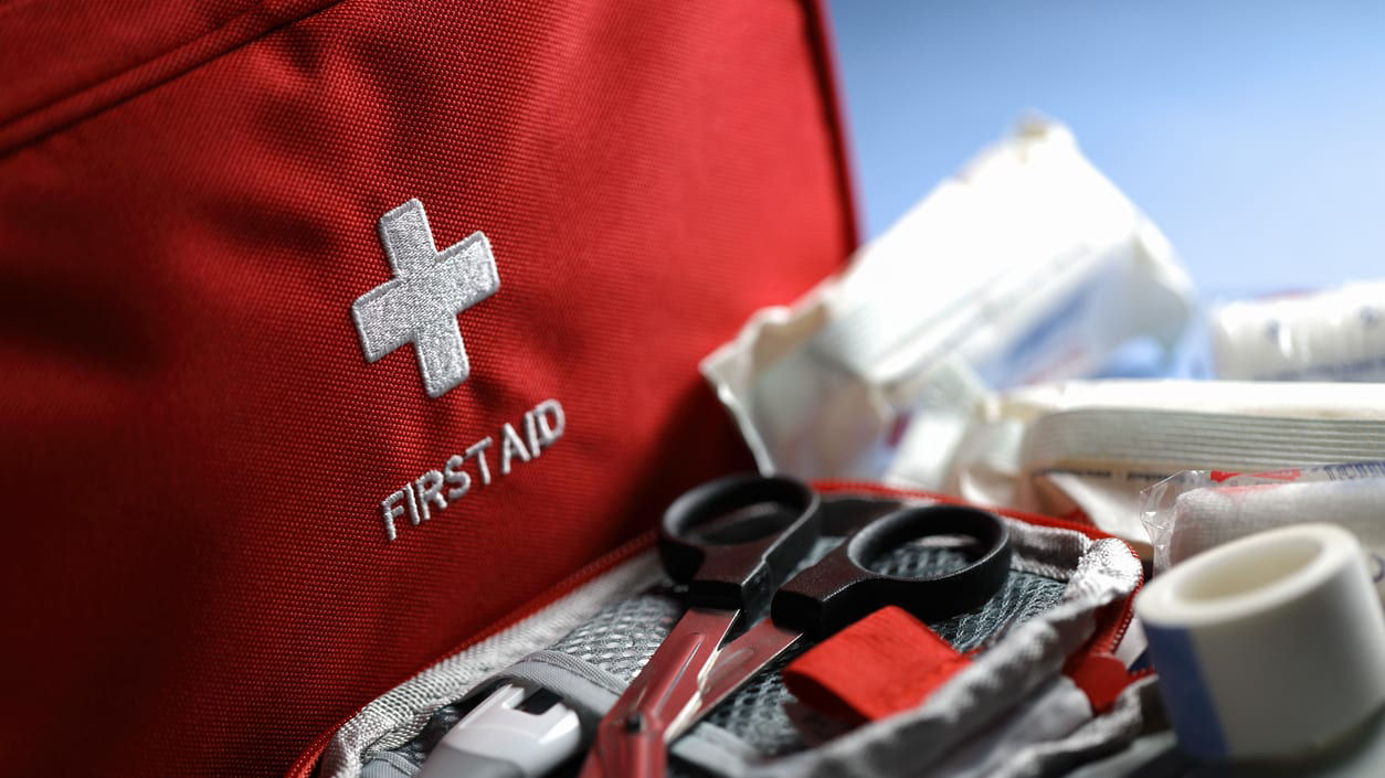 First aid kit in a red bag.