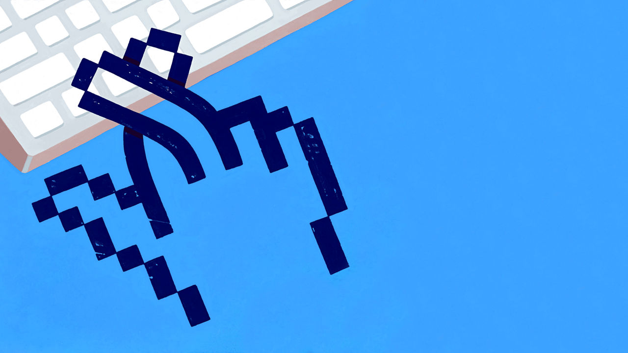 A pixelated image of a hand reaching for a keyboard.