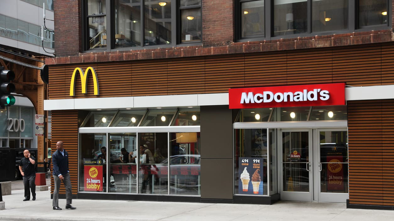 A mcdonald's restaurant on a city street.