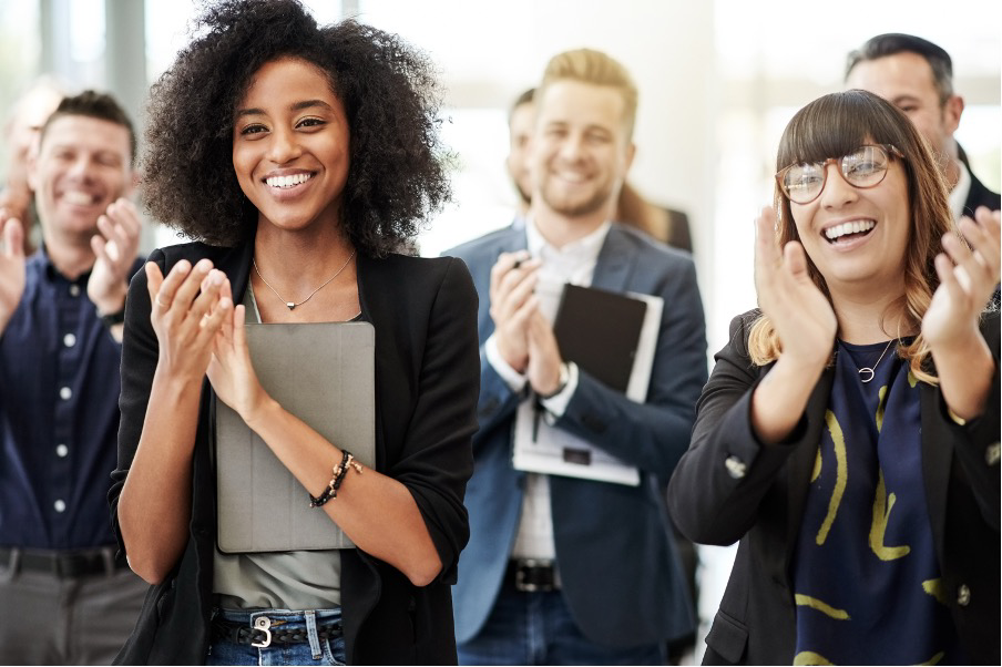People smiling and clapping
