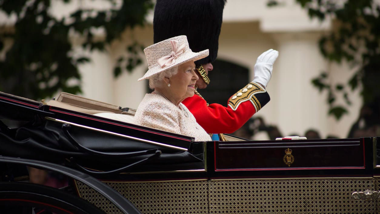 Queen elizabeth i of england riding in a carriage.