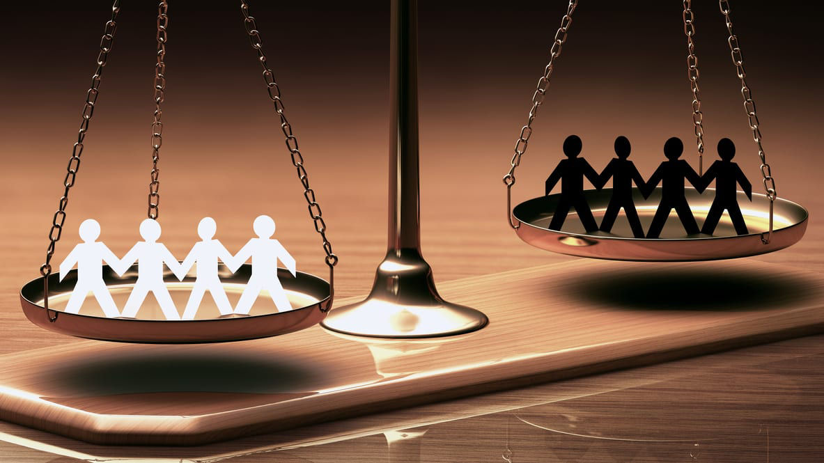 A pair of people on a balance scale.