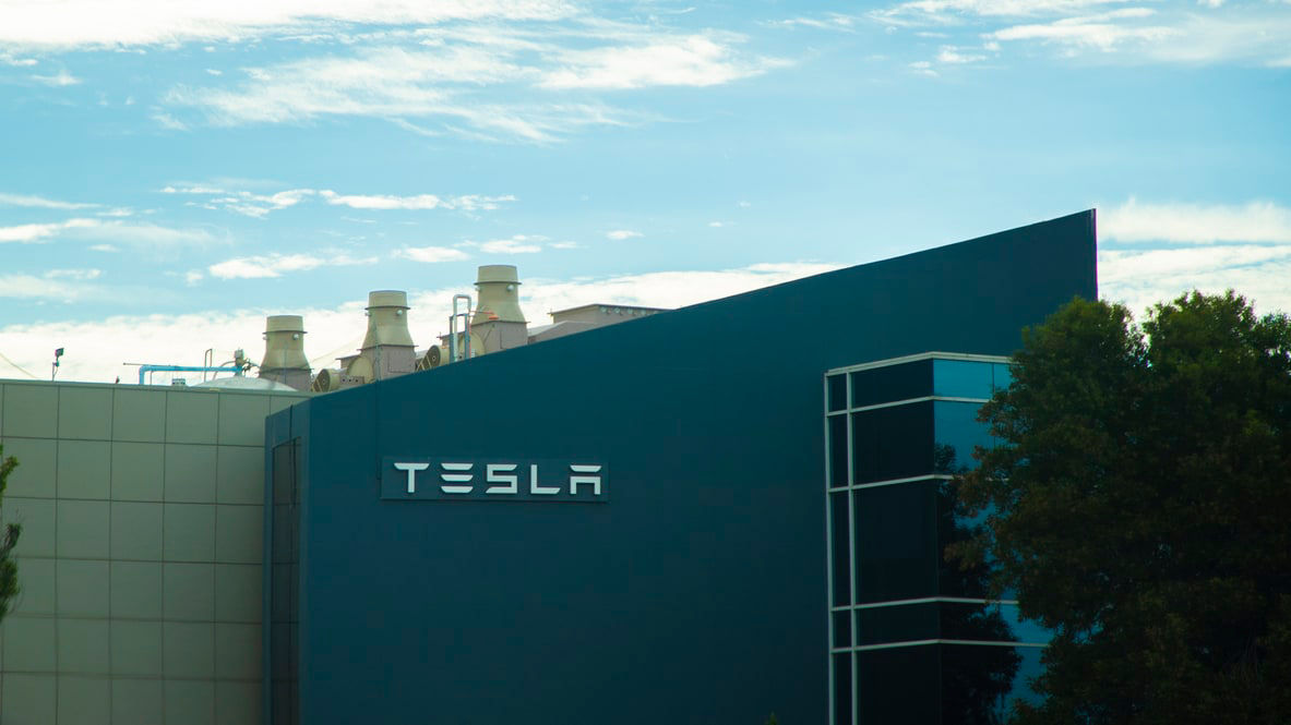 A building with a tesla logo on it.