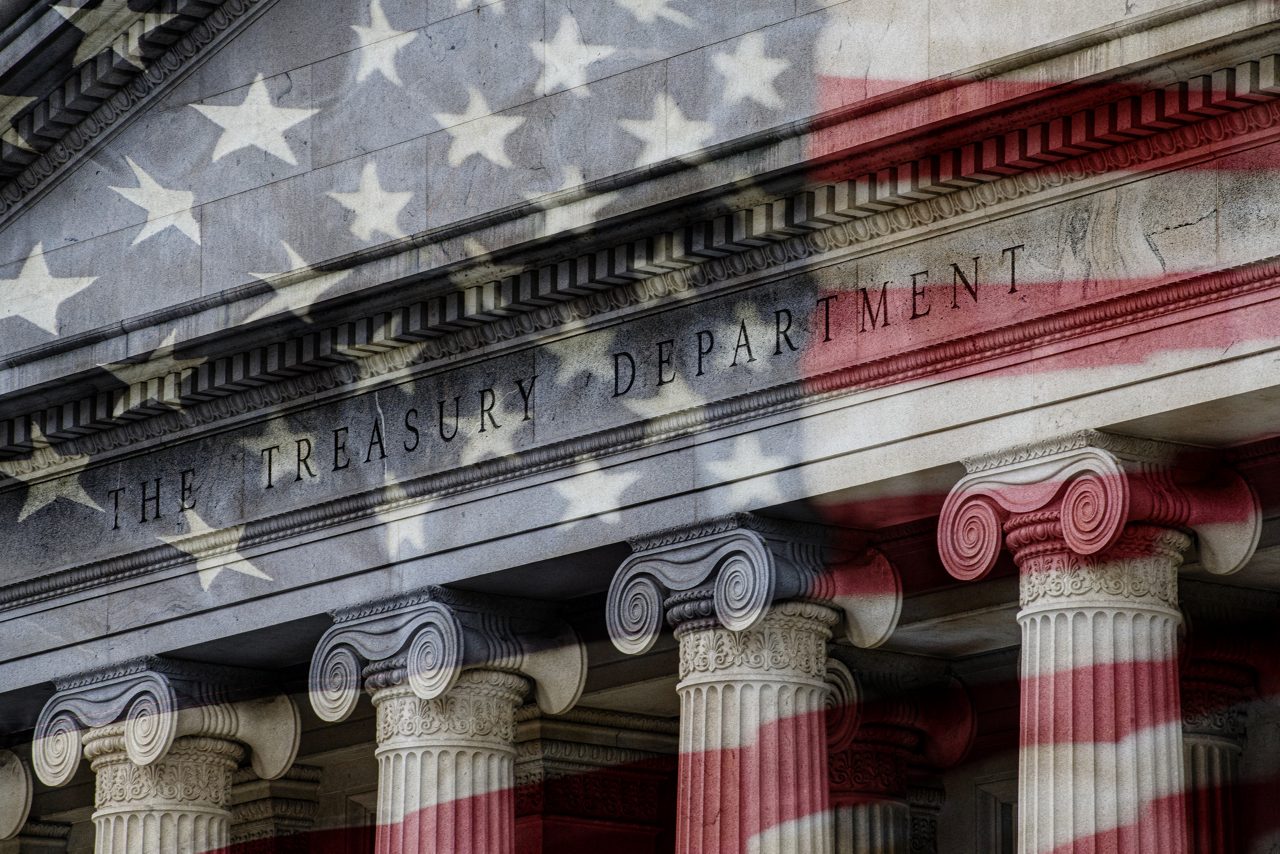 United States Treasury Department with image of U.S. flag waving before it