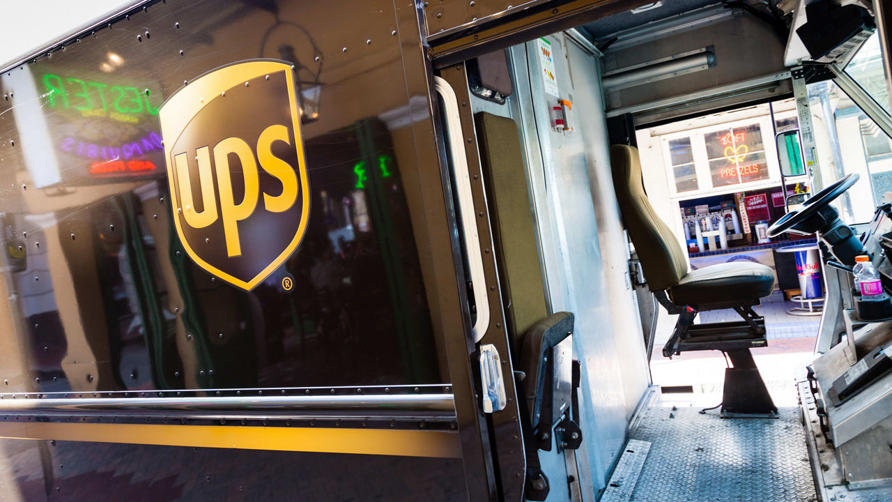 A ups truck is parked on a street.