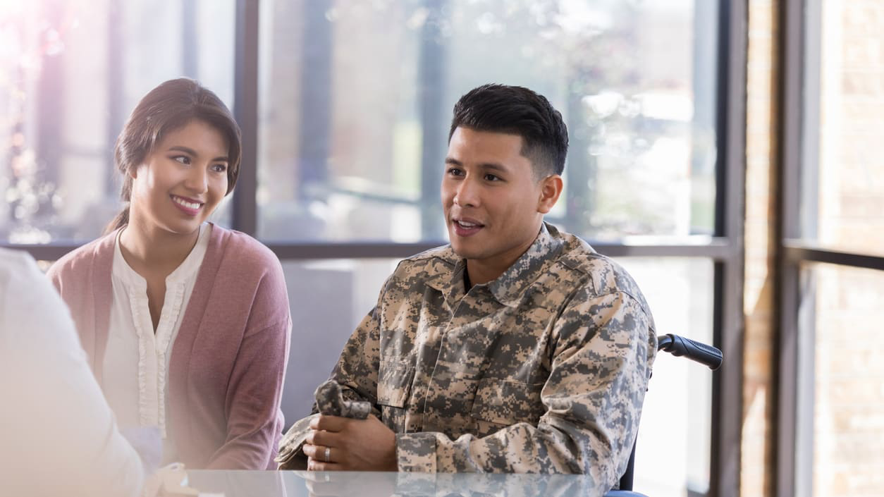 spouse sits with veteran during interview