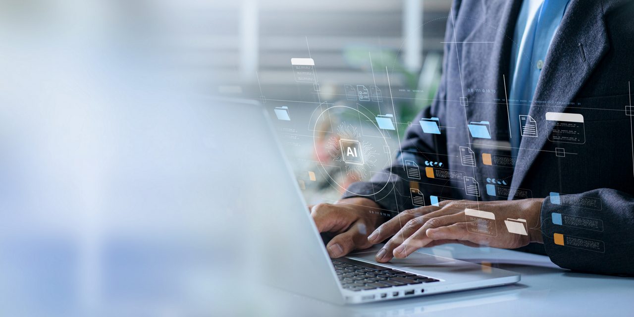 Employee with laptop overlaid with artificial intelligence icons